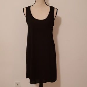 One Clothing black slip dress with ruffled back.